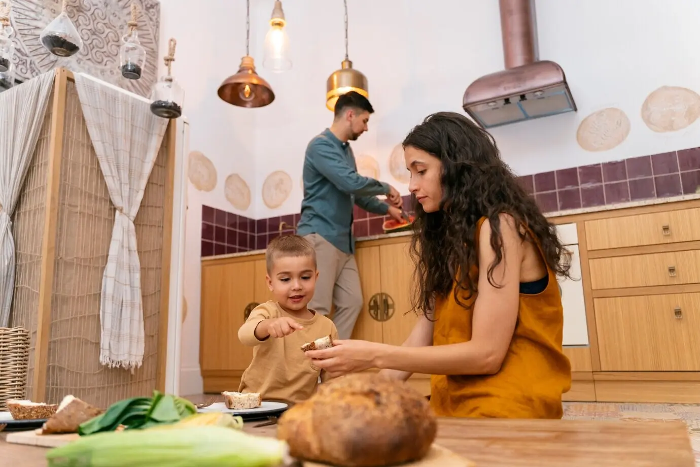 Low-angle shot of a woman and a kid sitting at a table.