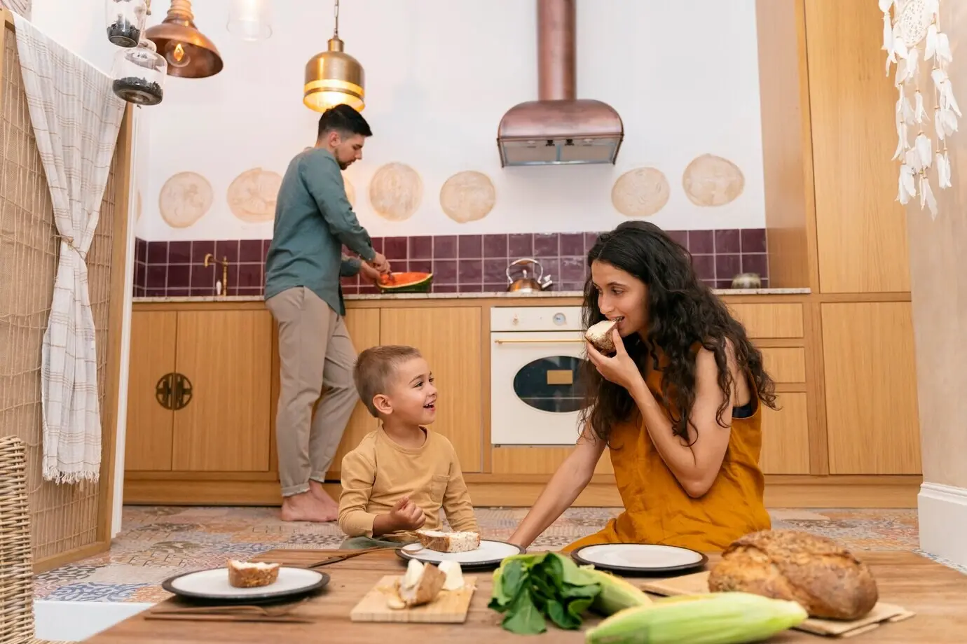 Medium shot of a woman and a child seated at a table.